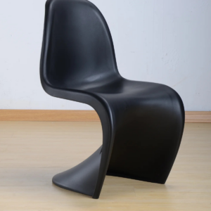 Modern black S-shaped accent chair with a sleek ergonomic design and sturdy molded construction, displayed on a light wooden floor against a white background.